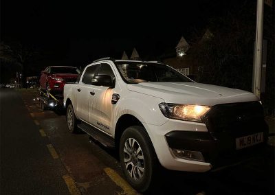 Red vehicle on car trailer